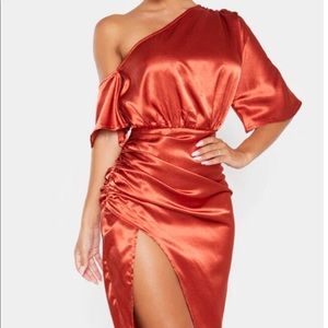 Burnt orange off the shoulder dress.